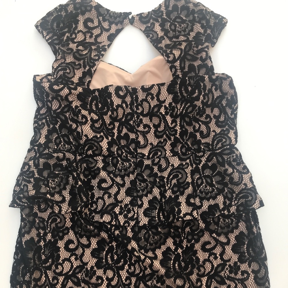 Formal peplum nude and black lace dress